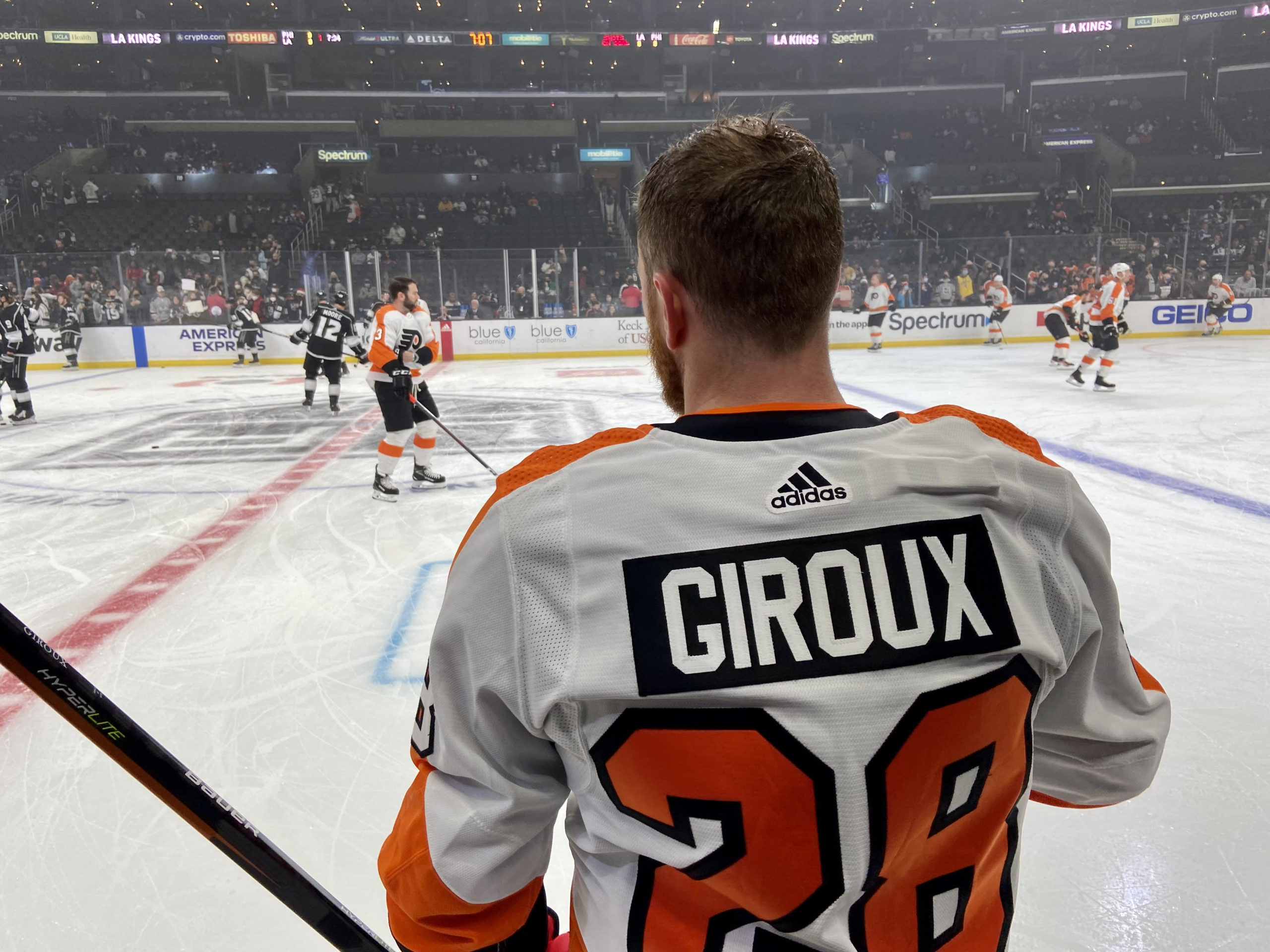 Claude Giroux #28 of the Philadelphia Flyers sits in the locker