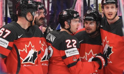Scott Laughton (second from right) celebrates Canada goal.