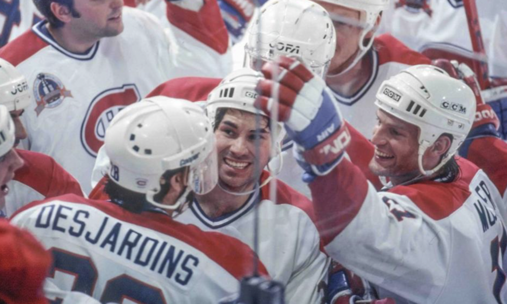 Canadiens celebrate Eric Desjardins' overtime goal in Stanley Cup finals.