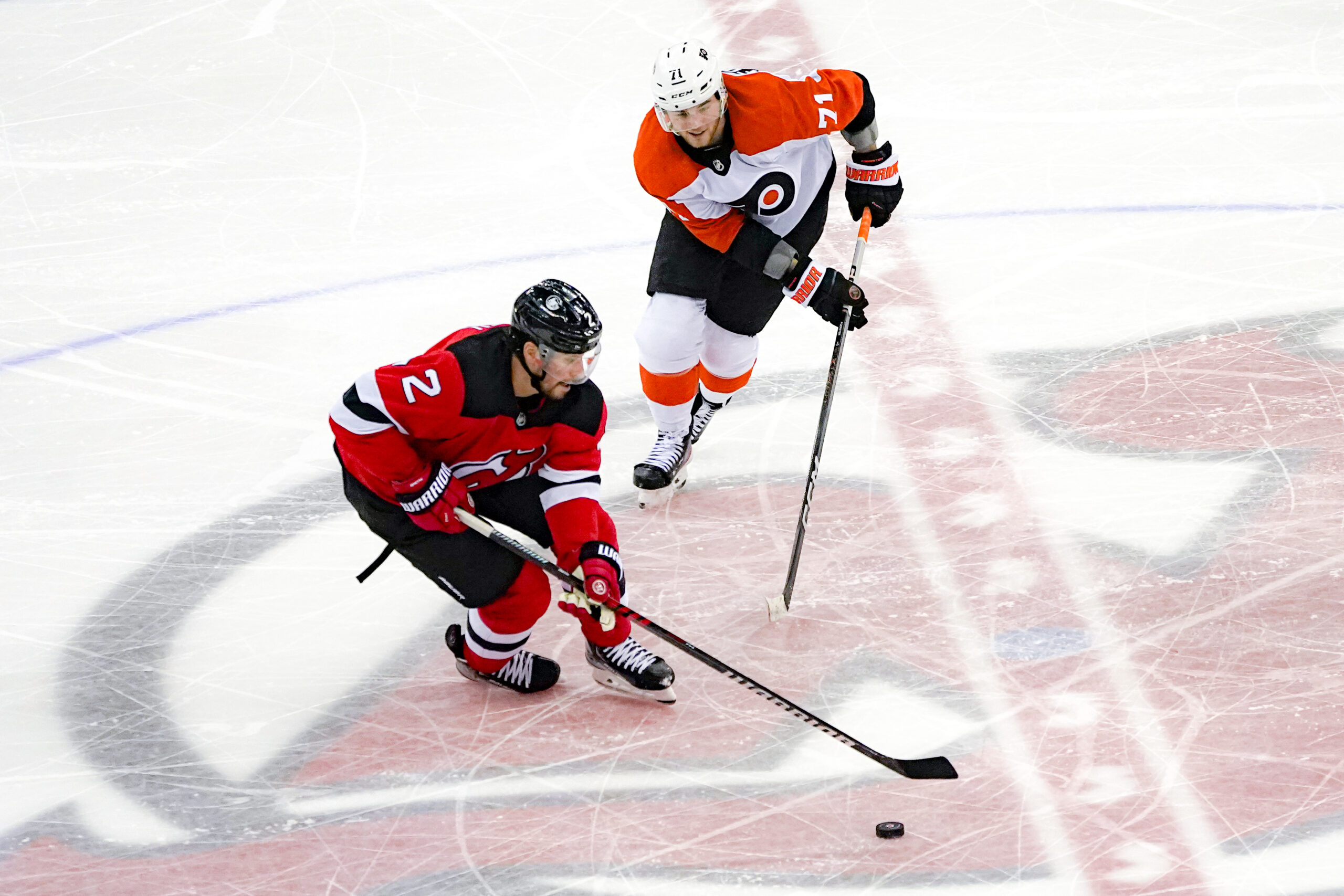 Philadelphia Flyers forward Tyson Foerster chases down a New Jersey Devils player